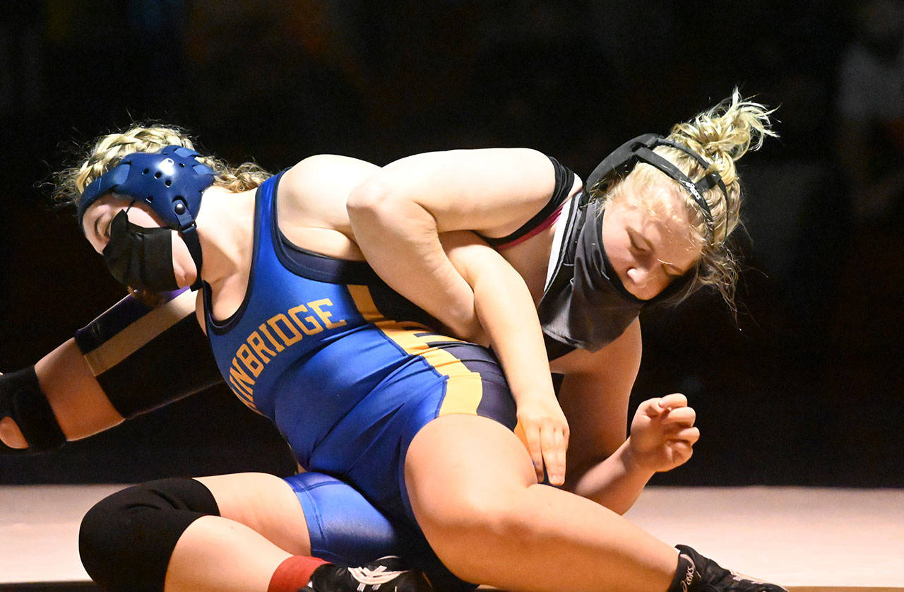Sequim’s Petra Bernsten, right, grapples with Bainbridge’s Aubrie Ackland during an Olympic League double dual meet on June 5. Bernsten, who won the 170-pound weight class match with a first-period pin, was named the league’ girls’ Most Valuable Player for 2020-2021. Sequim Gazette file photo by Michael Dashiell