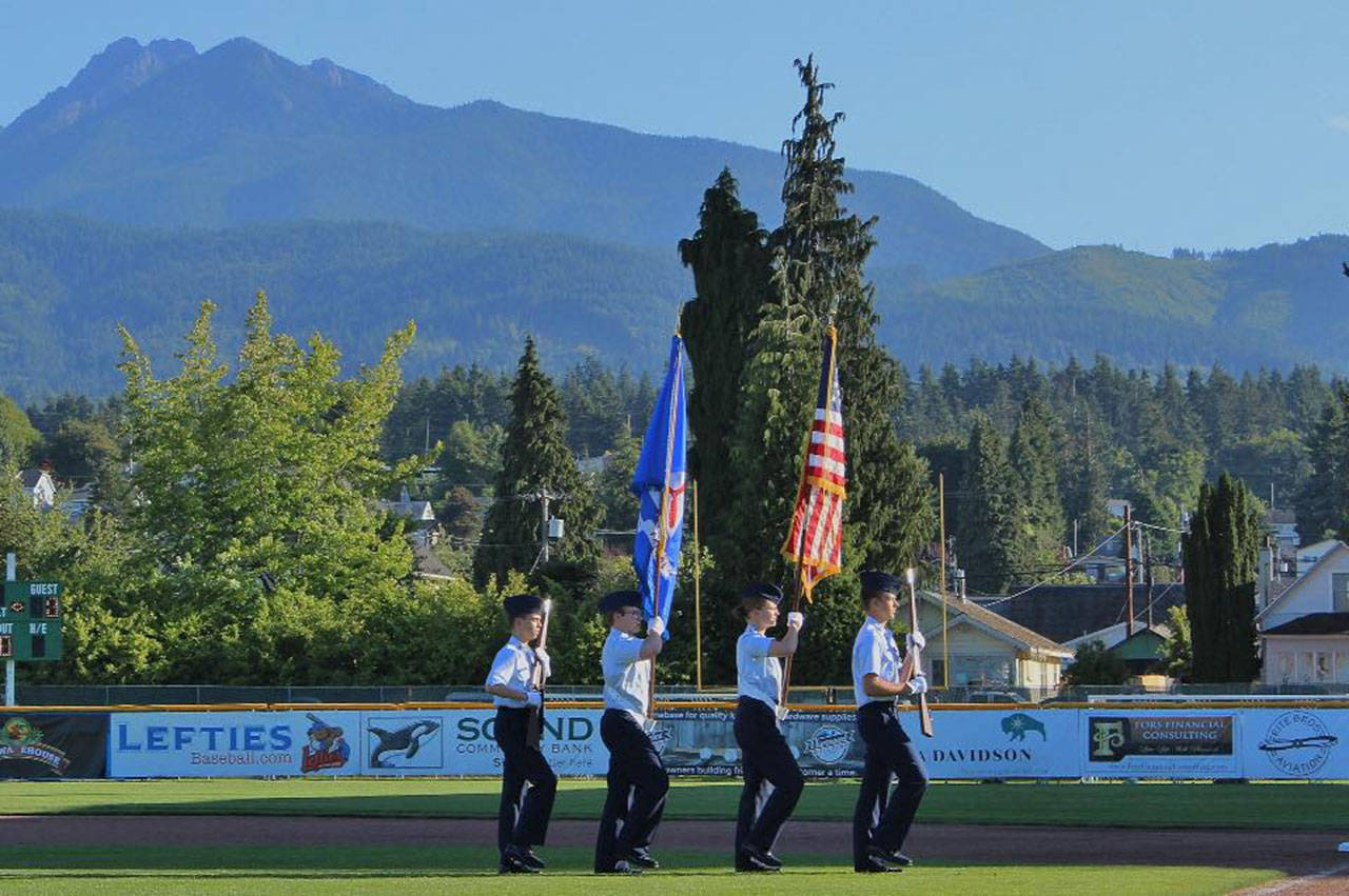 The Color Guard for Dungeness Composite Flight — The Civil Air Patrol (CAP) Unit of the Olympic Peninsula — presents the colors at a Lefties baseball game in Port Angeles in 2018. Pictured, from left are cadets (left to right) Carson Holt, Joe Benjamin, Madeline Patterson, and Jordan Hurdlow, all of Sequim. The CAP resumed in-person meetings and gather at 6:30 p.m. on Tuesdays at the William R. Fairchild International Airport meeting room, 1402 Fairchild Airport Road, Port Angeles. Submitted photo