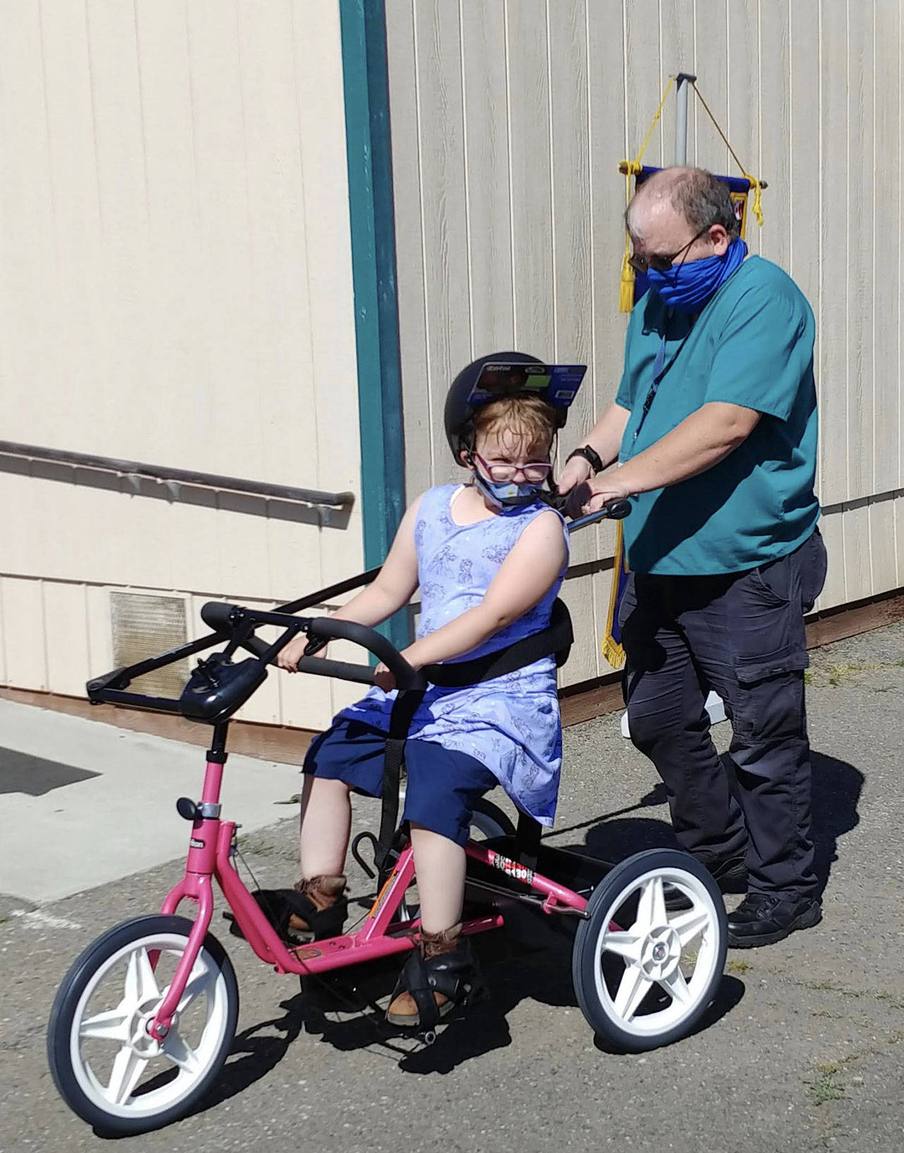 A Sequim students enjoys a ride on a newly-donated adaptive bicycle, donated by Rotary Club of Sequim. Submitted photo