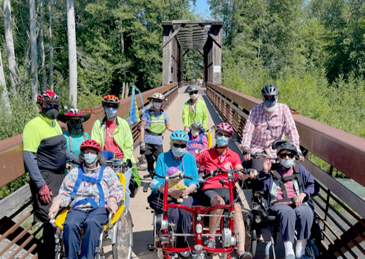 A first for the Sequim Wheelers o 2021’s first day of summer: The Sequim-based nonprofit breaks out all four of its adaptive bikes for the first time, on June 21. Photo by Tom Coonelly
