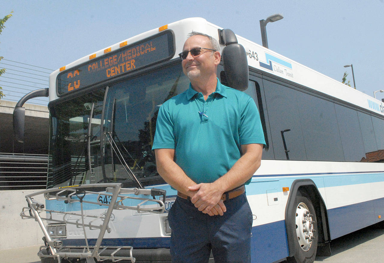 Clallam Transit General Manager Kevin Gallacci stands in front of a Route 20 bus last week. The route will see expanded service, including Peninsula College and Olympic Medical Center. Photo by Keith Thorpe/Olympic Peninsula News Group