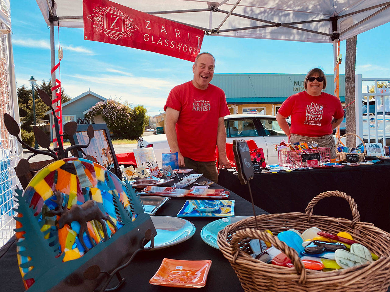 Susan Zarit, artist and owner of Zarit Glassworks, and husband Steve display the company’s wares at the Sequim Farmers & Artisans Market. Photos by Emma Jane”EJ” Garcia