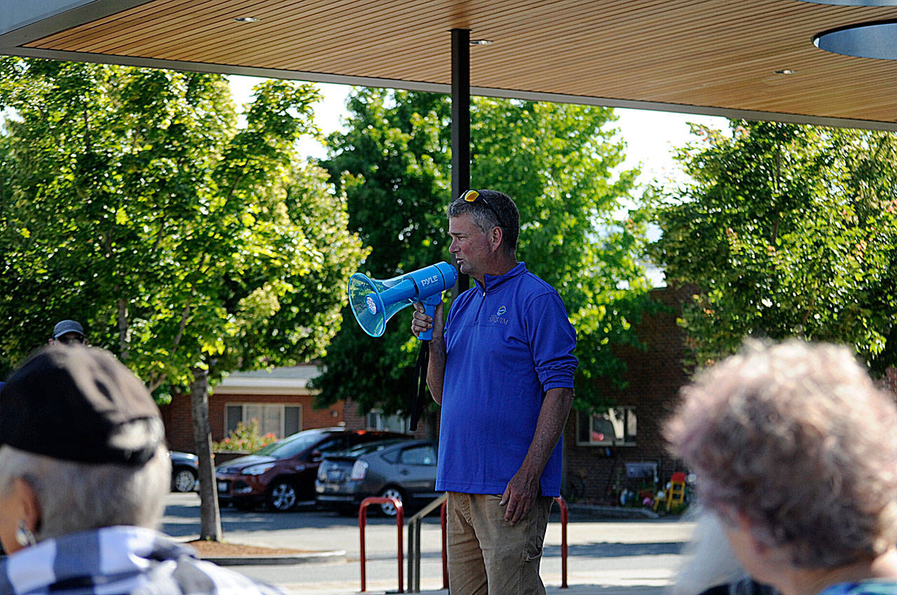 Gary Butler with the City of Sequim’s parks department thanks fellow staffers for their efforts and leadership in recent months during a rally on Monday in front of the Sequim Civic Center. Sequim Gazette photo by Matthew Nash