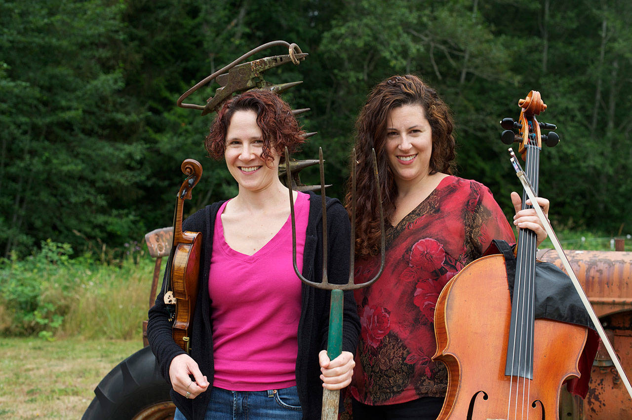 On a farm in Quilcene, the free Concerts in the Barn series will present classical music performances this summer, including Seattle Symphony violinist Elisa Barston, left, and her sister Amy Sue Barston, a cellist, on July 31 and Aug. 1. With pianist Jessica Choe joining them, the Barstons will become Trio Hava, performing music of Lily Boulanger, Ludvig van Beethoven and Johannes Brahms. Photo courtesy of Concerts in the Barn