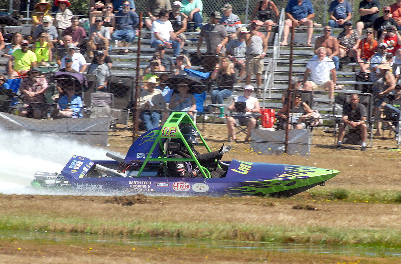 The Sequim-based Live Wire No. 2 sprint boat driven by Vaughan Trapp and navigated by Matt Denson roars past the Extreme Sports Park audience during races in Port Angeles on July 24. Photo by Keith Thorpe/Olympic Peninsula News Group