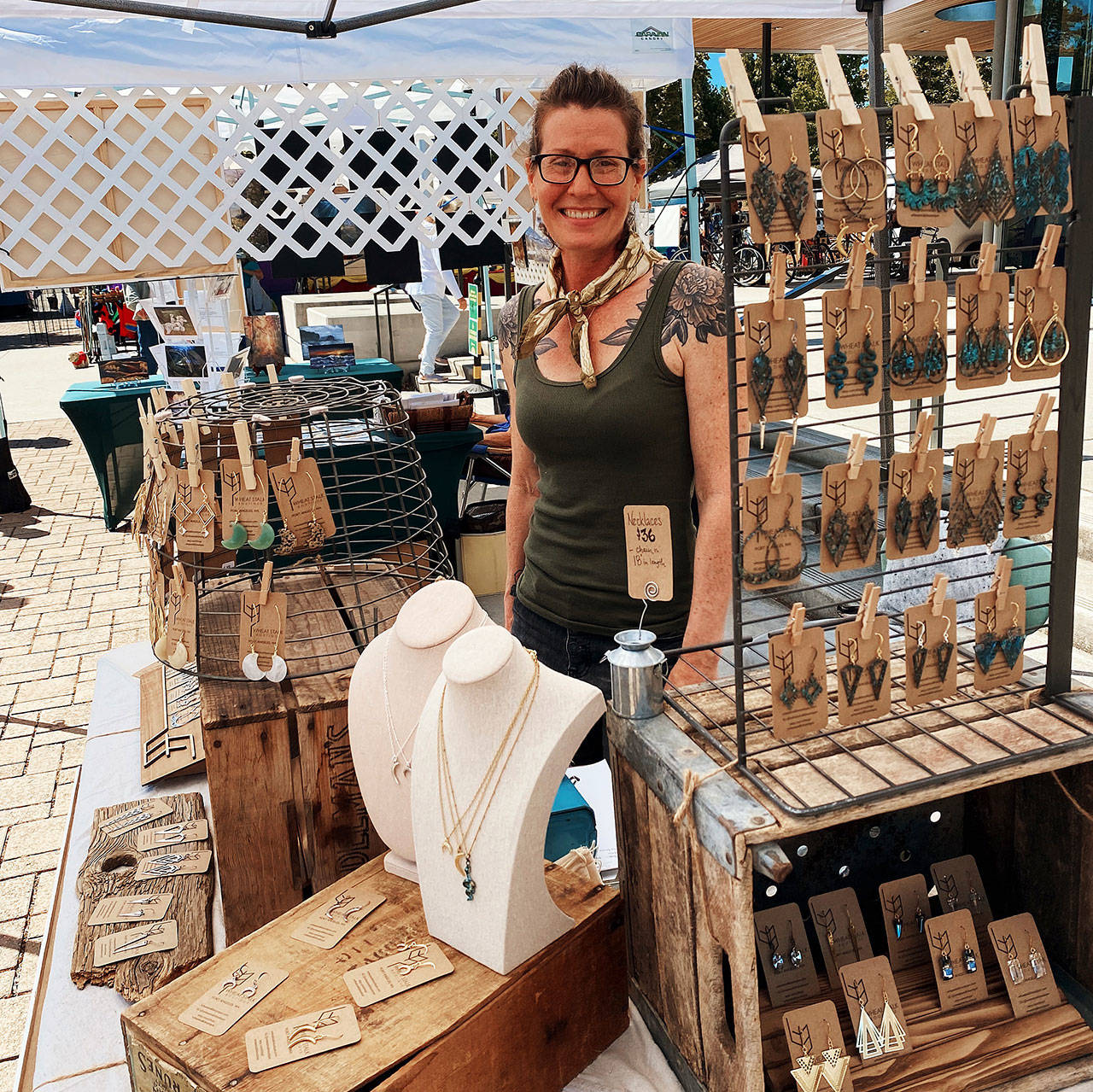 Erica Harris brings her creative eye to offer wearable art at the Wheat Stalk Boutique booth, featured at the Sequim Farmers and Artisans Market this summer. Photo by Emma Jane “EJ” Garcia
