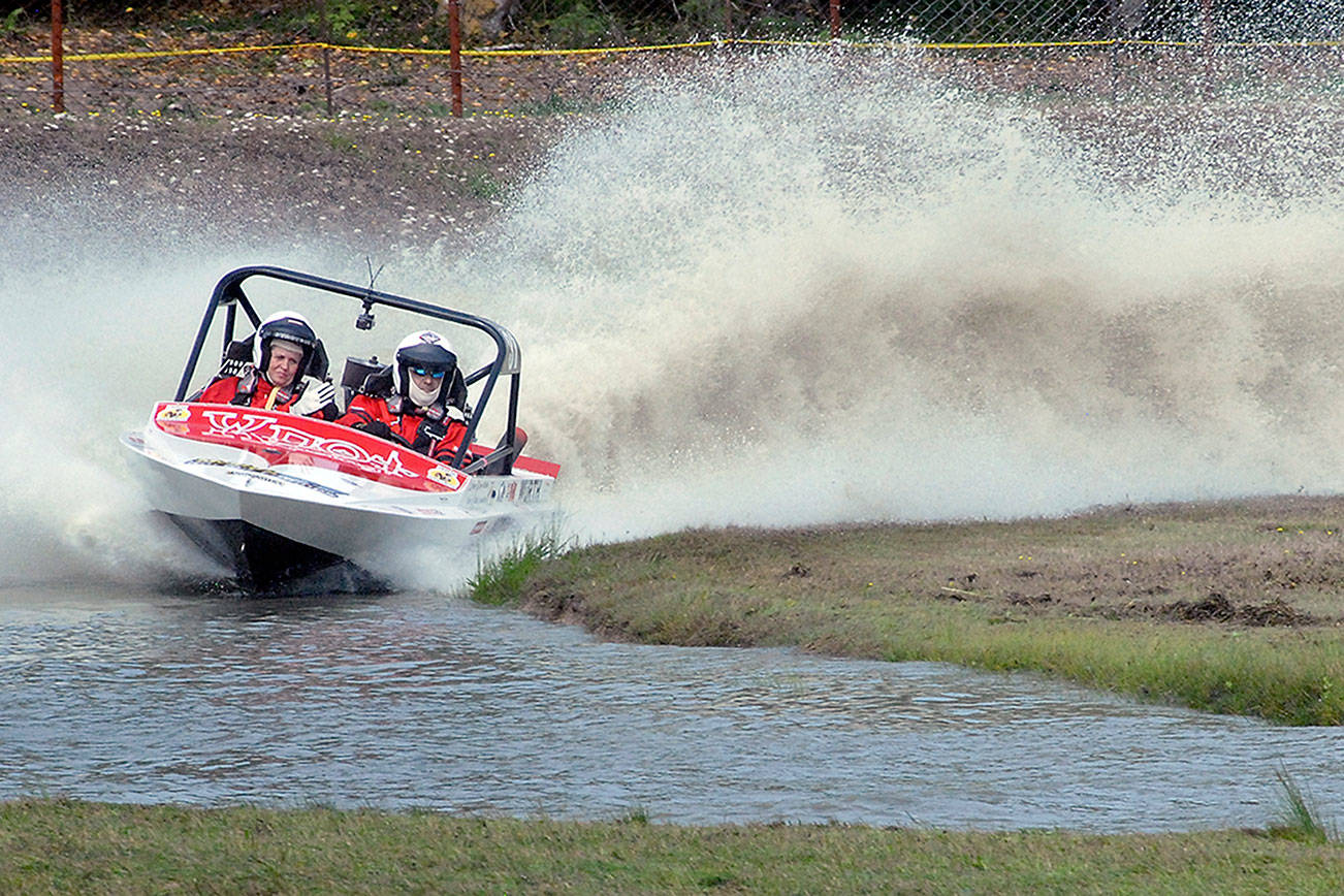 Keith Thorpe/Peninsula Daily News
The Ynot Racing sprint boat racing team of navigator Jamie Johnson, left, and driver Dave Brown makes it way around the course in 2019 at Extreme Sports Park in Port Angeles.