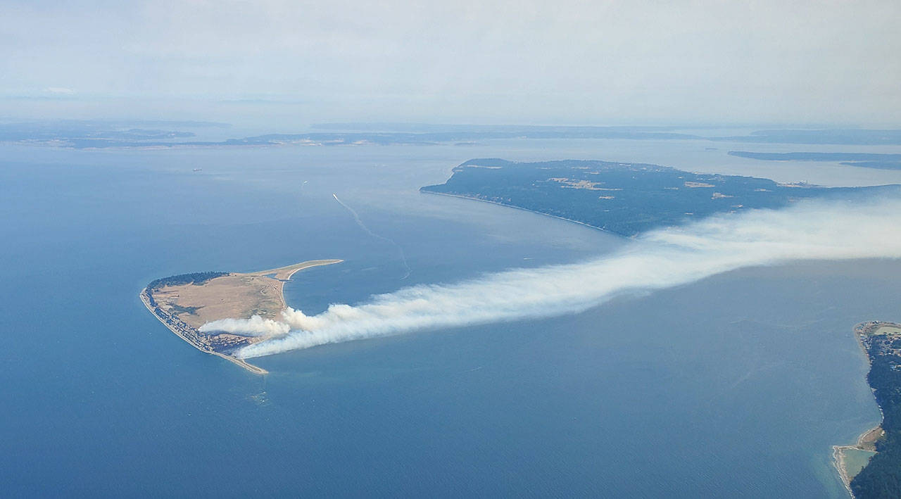 Smoke from a fire on Protection Island drifts across the Strait of Juan de Fuca Tuesday afternoon. Photo by Jack Graham/jackgrahamaviation.com