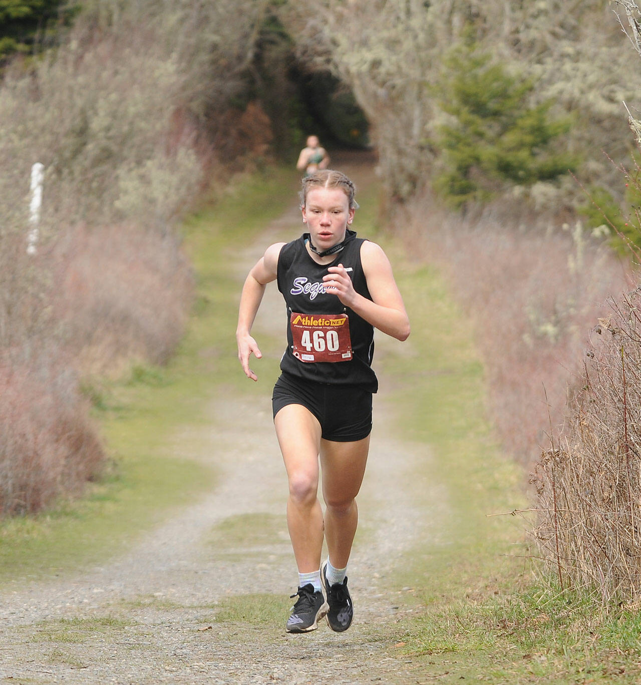 Sequim junior Riley Pyeatt breaks out to a big lead as she helps the Wolves with a one-point win over Klahowya at Voice of America Park on March 6, Sequim’s lone home meet of the abbreviated 2020-2021 season. Sequim Gazette file photos by Michael Dashiell