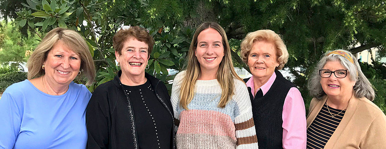 Sequim High graduate Kalli Wiker, center, accepts a scholarship from the Sequim P.E.O. Chapter HM. Pictured with Wiker are, from left, Pam Grandstrom, Charlotte Hudson, Shirley Sutterlin and Nancy Gilchrist. Submitted photo
