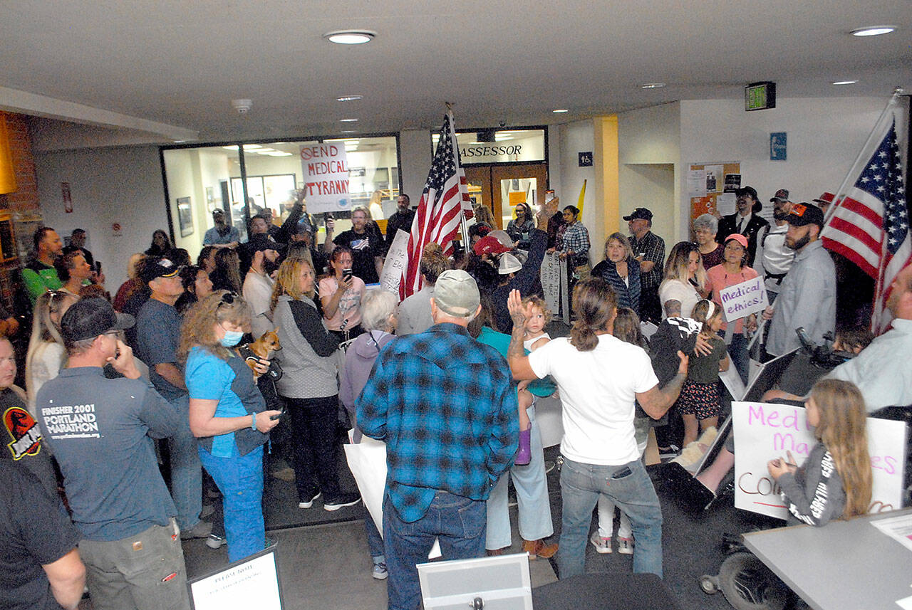 Protesters gather in the lobby of the Clallam County Courthouse on Sept. 3. Photo by Keith Thorpe/Olympic Peninsula News Group