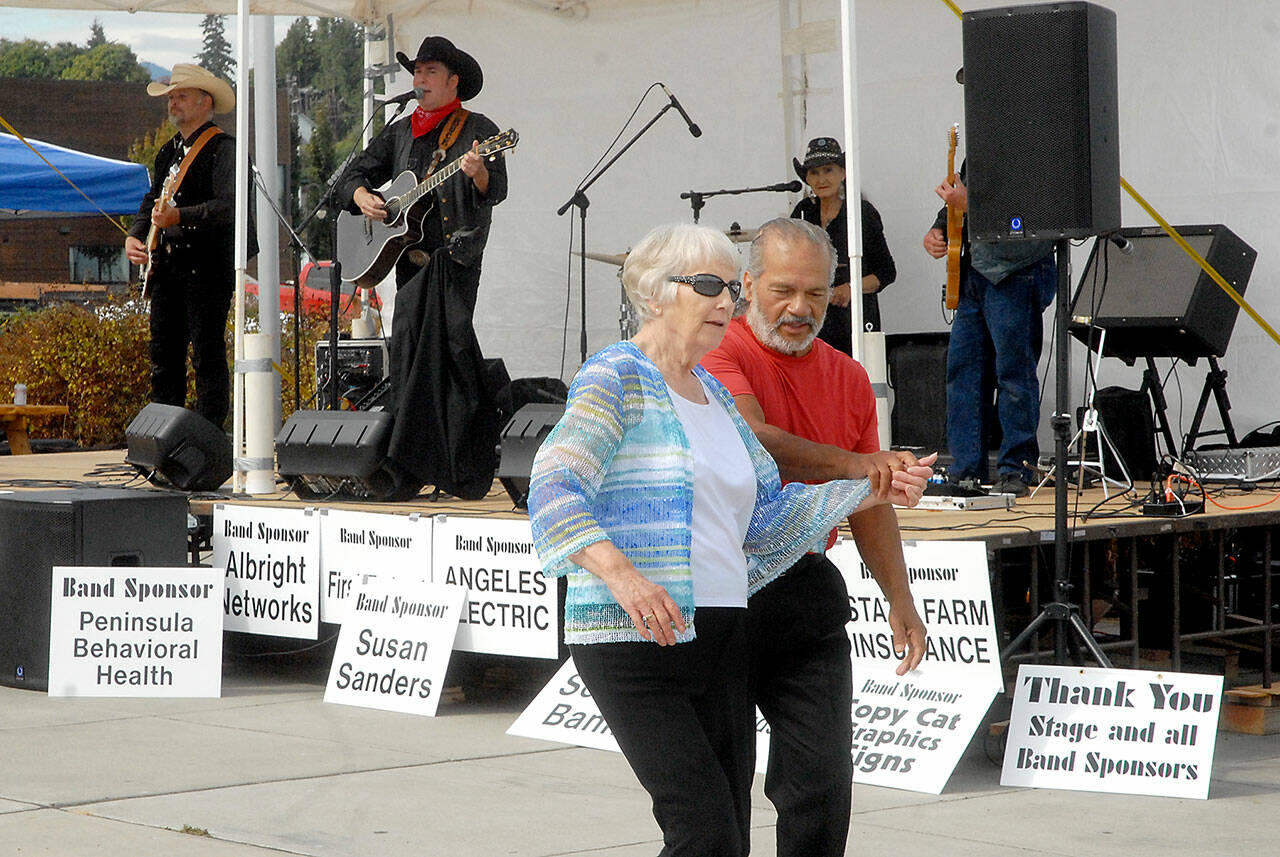 Loretta Bilow of Sequim, left, and Angel Ortiz of Port Angeles dance to the music of the Buck Ellard Band during Jammin’ in the Park at Pebble Beach Park in Port Angeles on Sept. 4. The event, hosted by Nor’Wester Rotary and Koenig Subaru, featured music, food, children’s activities and a car show. Photo by Keith Thorpe/Olympic Peninsula News Group