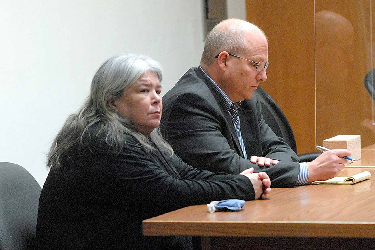 Larisa Jean Dietz of Sequim sits with attorney Stan Myers in July at Clallam County Superior Court in Port Angeles. (Keith Thorpe/Peninsula Daily News)