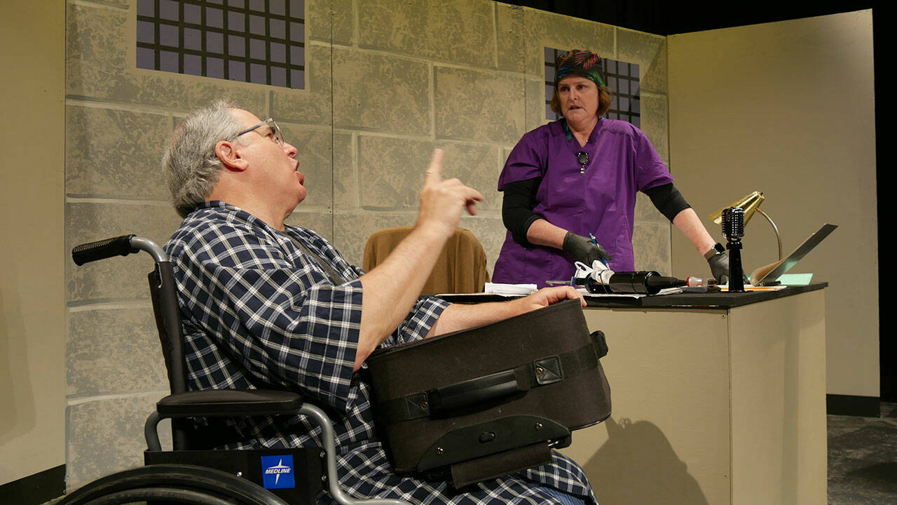 Joel Hoffman and Vicki Miller rehearse the arrival of Hoffman’s trouble-making character in rehearsals of Olympic Theatre Arts’ “A Facility for Living,” a comedic production set to open Oct. 1. Photo courtesy of Olympic Theatre Arts