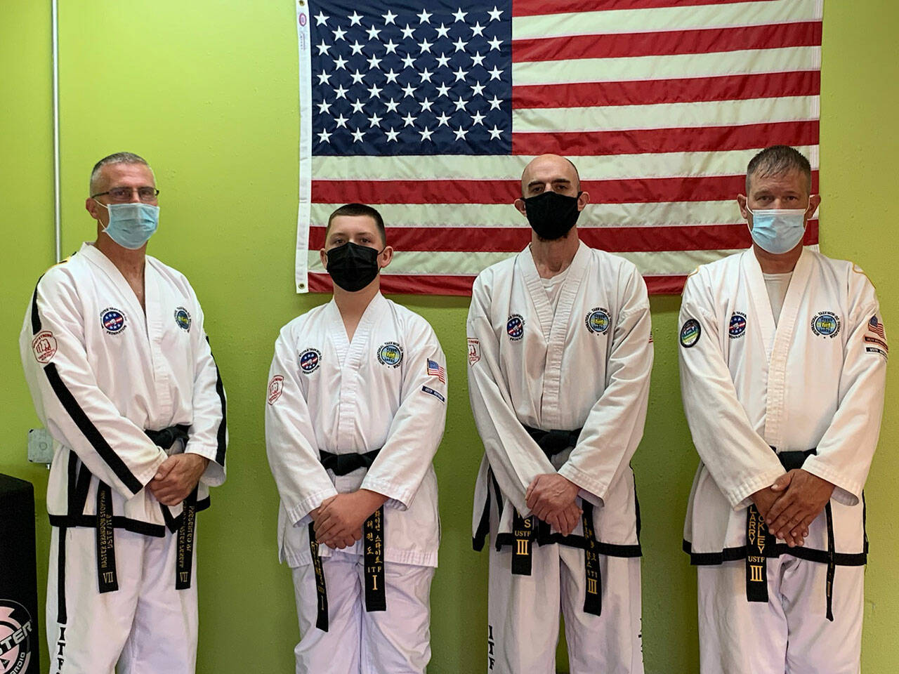 Pictured with instructor Brandon Stoppani (far left) are Bodystrong Taekwon-do Academy students Ryan Stites, Troy Phipps and Larry Muckley. Submitted photo