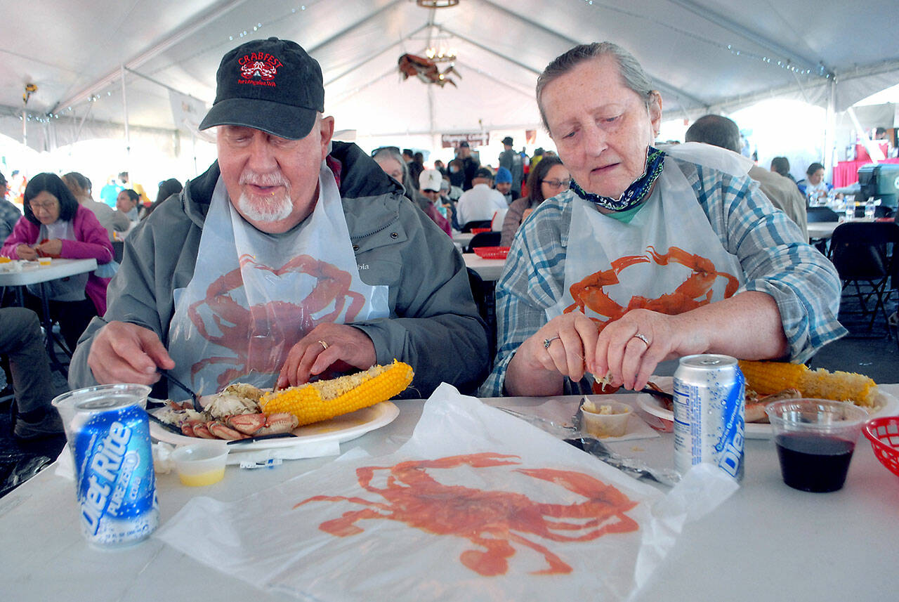 Larry and Kathi Hayden of Port Angeles enjoy crab dinners on Oct. 8 at the Dungeness Crab and Seafood Festival in Port Angeles. Photo by Keith Thorpe/Olympic Peninsula News Group