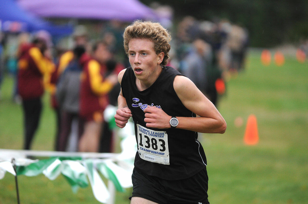 Sequim High junior Colby Ellefson races to the finish line at the Olympic League championships on Oct. 21. Ellefson placed third overall. Sequim Gazette photo by Michael Dashiell