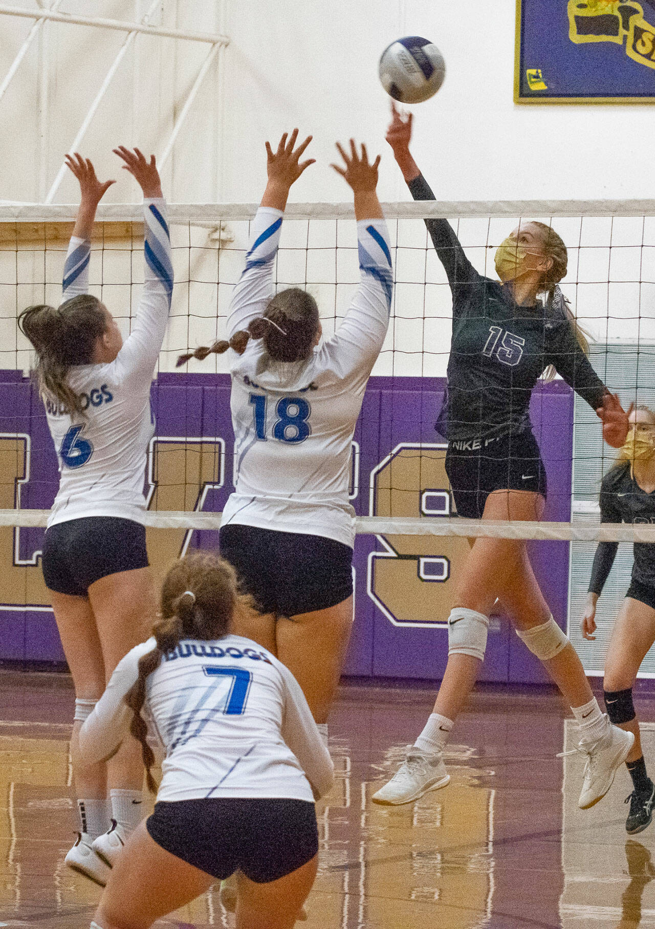 Sequim’s Kendall Hastings, right, tips a shot past North Mason defenders in the Wolves’ 3-1 Olympic League win on Oct. 26 Sequim (9-5 in league, 10-5 overall) was to host Kingston in a league seeding tournament game on Nov. 2. Sequim Gazette 
photo by Emily Matthiessen