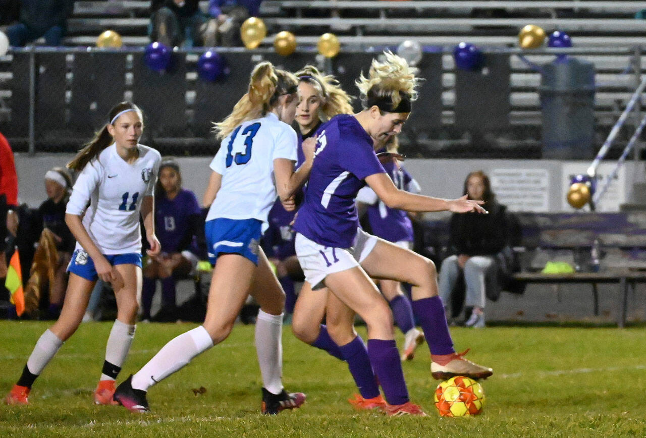 Sequim’s Kaia Lestage, right, battles for the ball in Sequim’s Olympic League match-up with North Mason on oct. 27. Sequim Gazette photo by Michael Dashiell