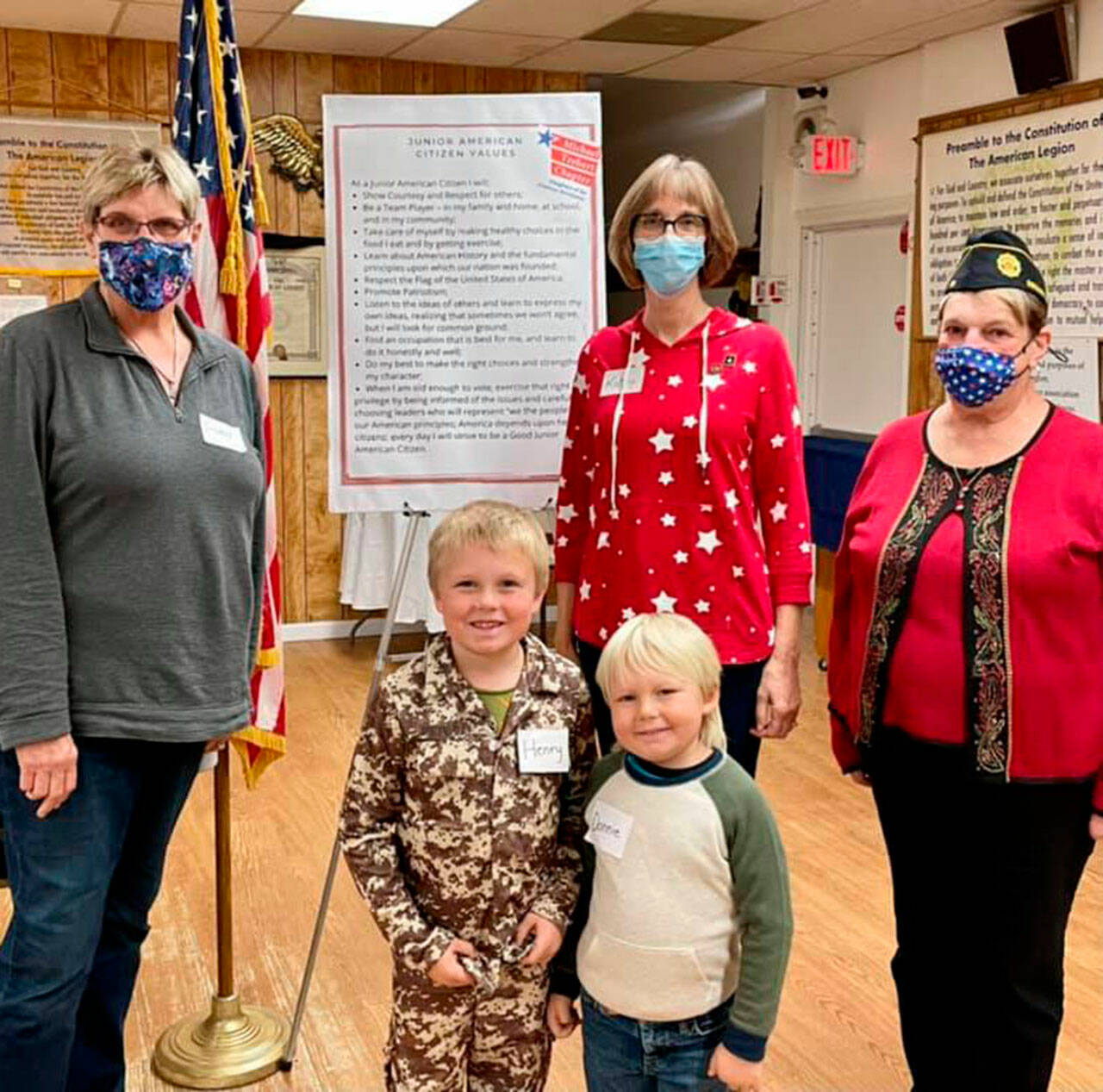 Veterans Susan Sorenson, Kathy Dobbins and Nancy Zimmerman join Henry and Donnie Fors at a meeting of the Junior American Citizens club in Sequim in early November. Submitted photo