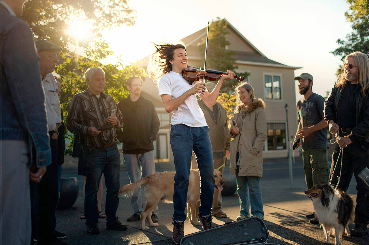 Marina Shipova’s photograph of a young violinist playing at Centennial Place is one of a series the peninsula photographer created as part of the Sequim Understory Project. Shipova will be outside the Sequim Civic Center from 1-3 p.m. Saturday, Nov. 27, as a part of the Art Beat event. Photo by Marina Shipova