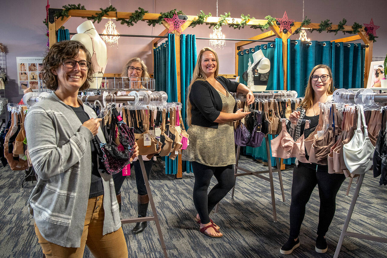 Kelly Iriye, Penny Hooker, owner Sarah Nightingale, and Maggie Bettger show some of the stock found at Northwest Bras, a fit-focused undergarment, lingerie and swimwear shop located at 755 West Washington Street Suite E. Sequim Gazette photo by Emily Matthiessen