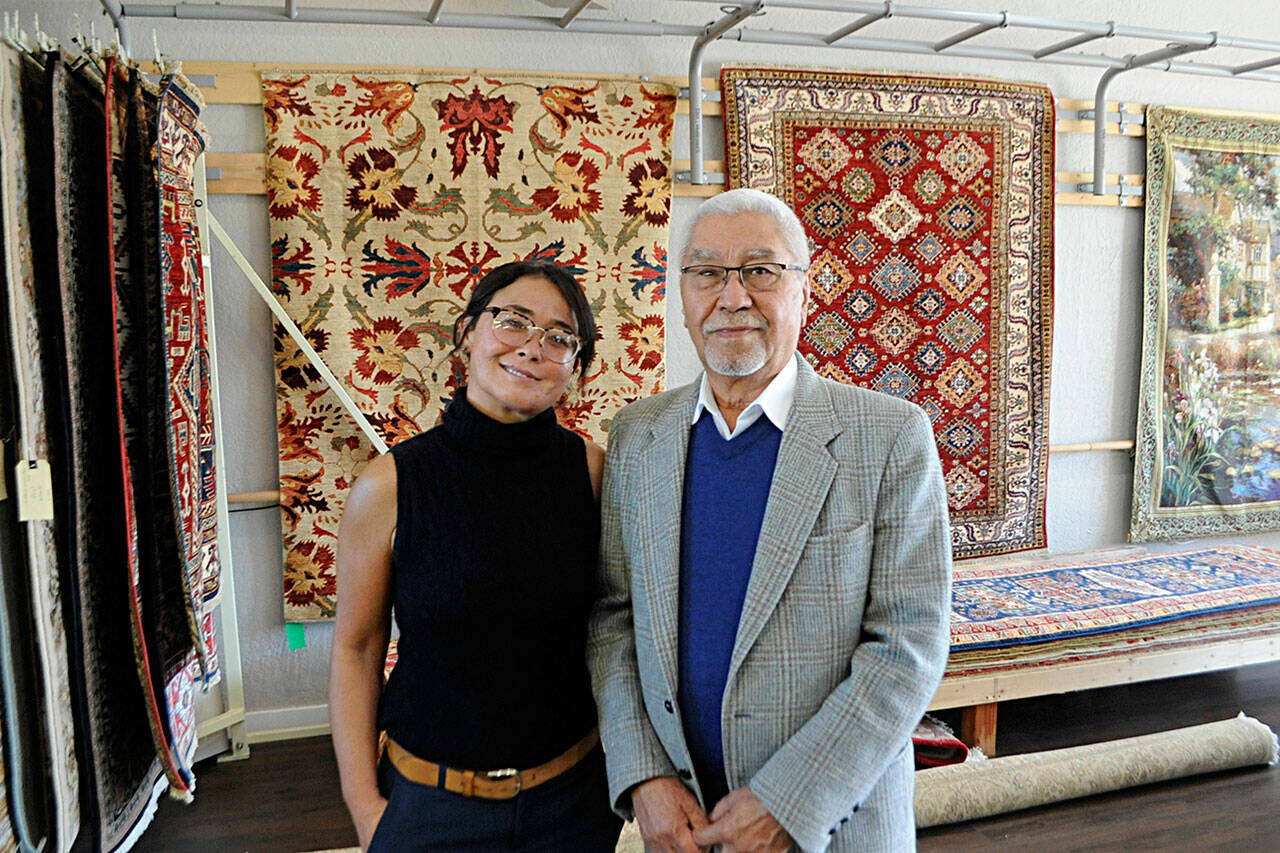 For five years, Mohammad Amin Rahmati has repaired, washed and sold rugs through his Oriental Rug Care on Bell Street. He and his family, including daughter Muzghan Muzgi left Afghanistan in 1980 during the Soviet-Afghan War and eventually arrived in Los Angeles on Christmas Day 1982. Hes carried on a family tradition with rugs. Sequim Gazette photo by Matthew Nash