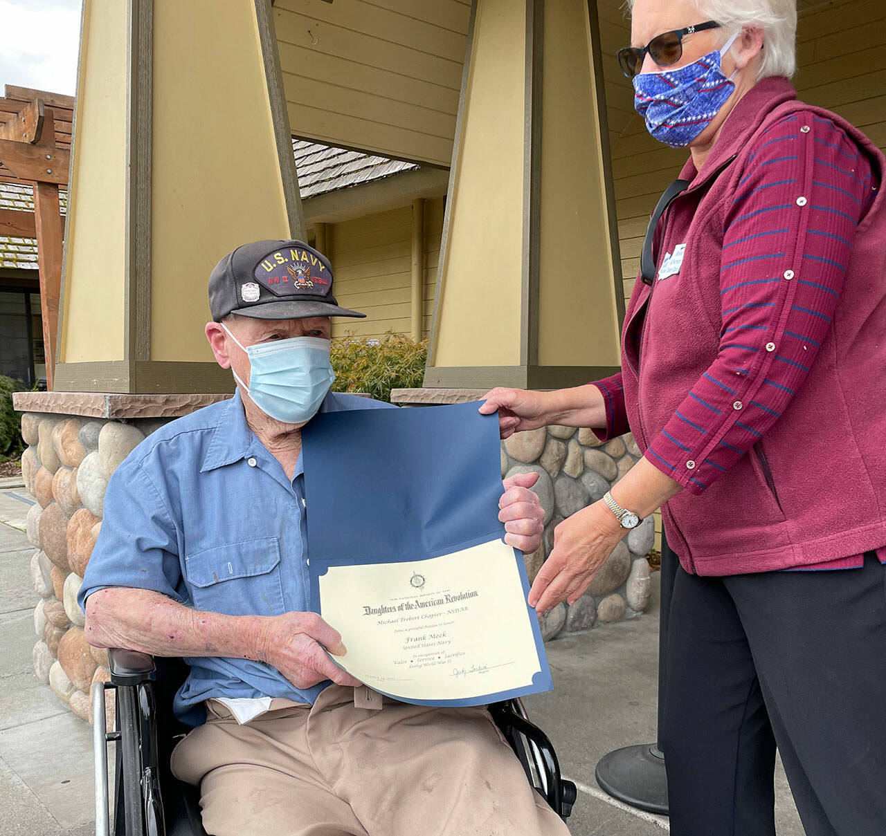 Sequim’s Frank Meek, a 96-year-old World War II veteran (U.S. Navy) receives a National Society of the Daughters of the American Revolution “thank you for your service” certificate outside Avamere Olympic Rehabilitation of Sequim in November. Submitted photo
