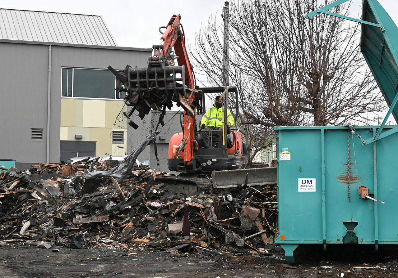 Demolition continues this week behind the Sequim Civic Center on West Spruce Street on a home that a fire destroyed in June. Property owner Ron Fairclough said it’s unclear what his next steps will be with the property. Sequim Gazette photo by Michael Dashiell