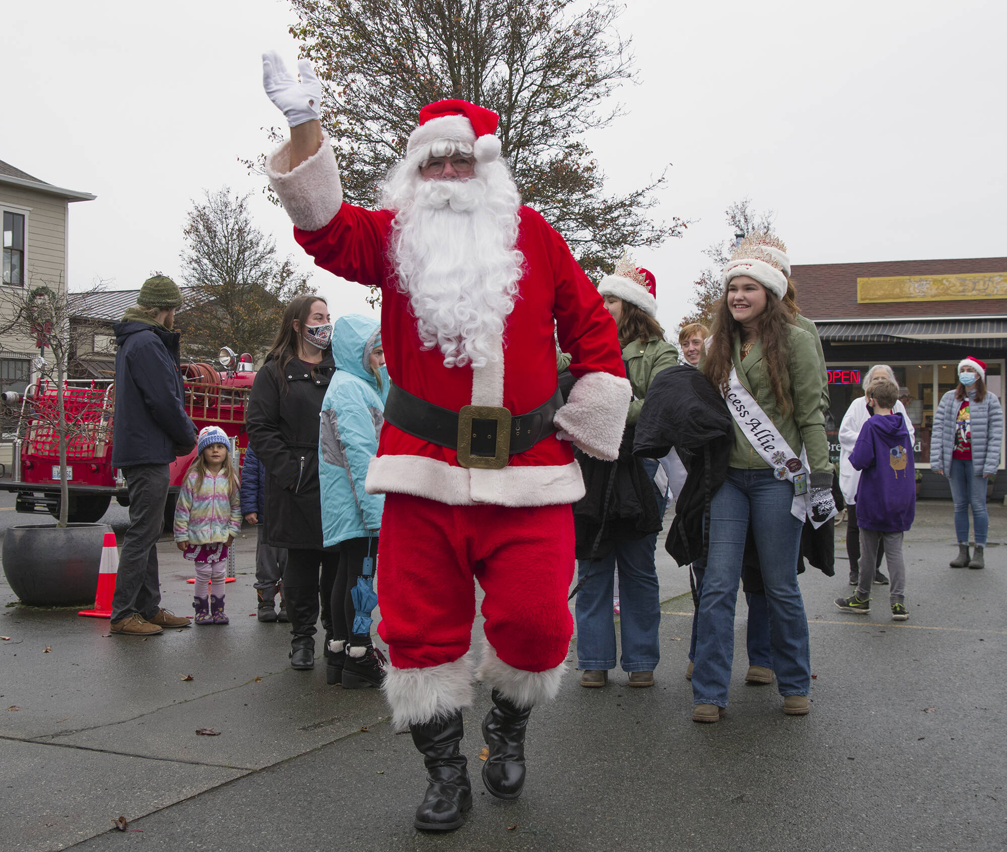 Santa, aka Stephen Rosales, waves to visitors of the Home Town Holidays event last month. Sequim Gazette photo by Emily Matthiessen