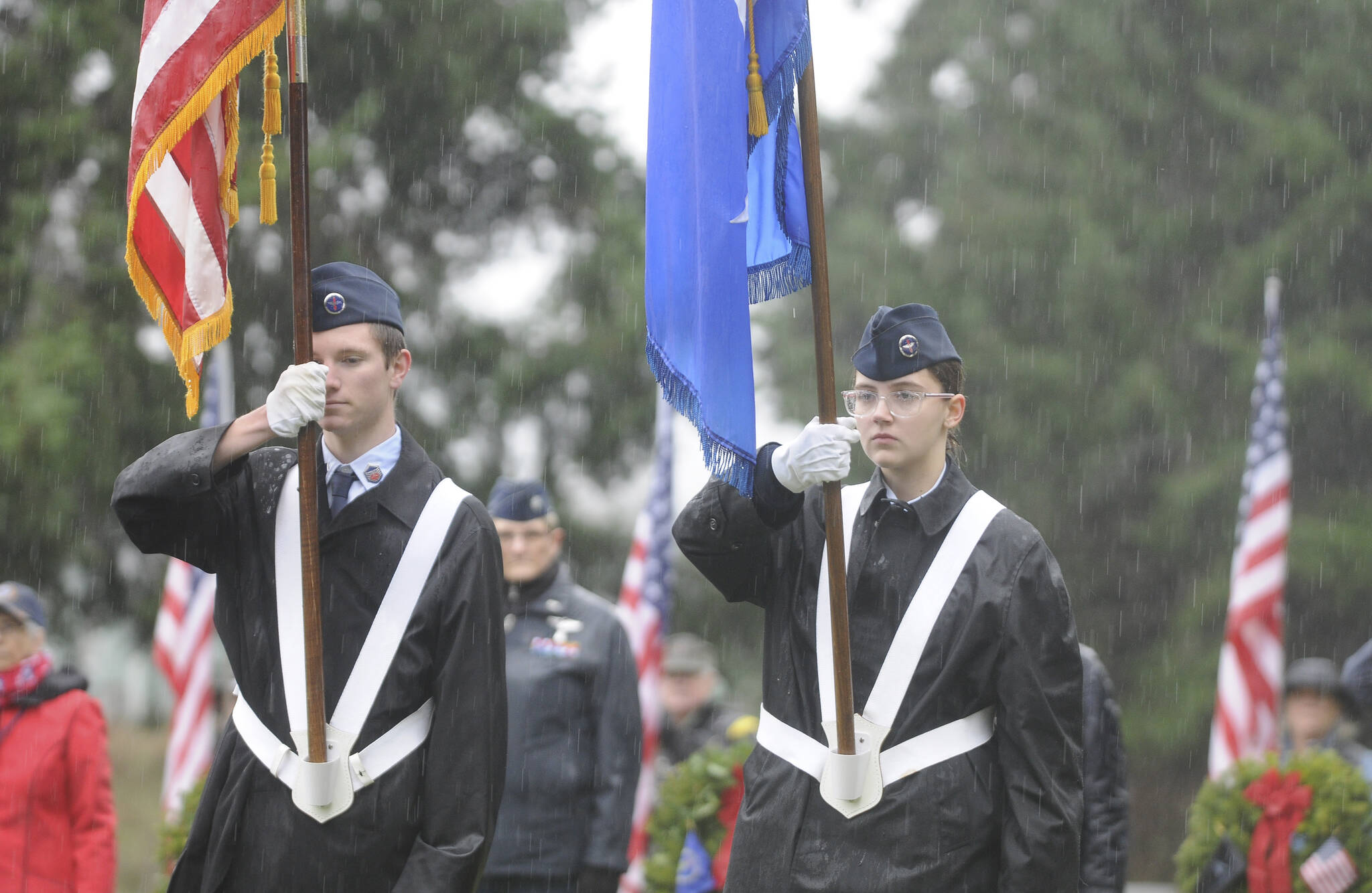 Jackson Imholt and Faith Amaya of the Civil Air Patrol-Dungeness Composite Flight present colors at the Wreaths Across America ceremony in Sequim Saturday morning. Sequim Gazette photo by Michael Dashiell