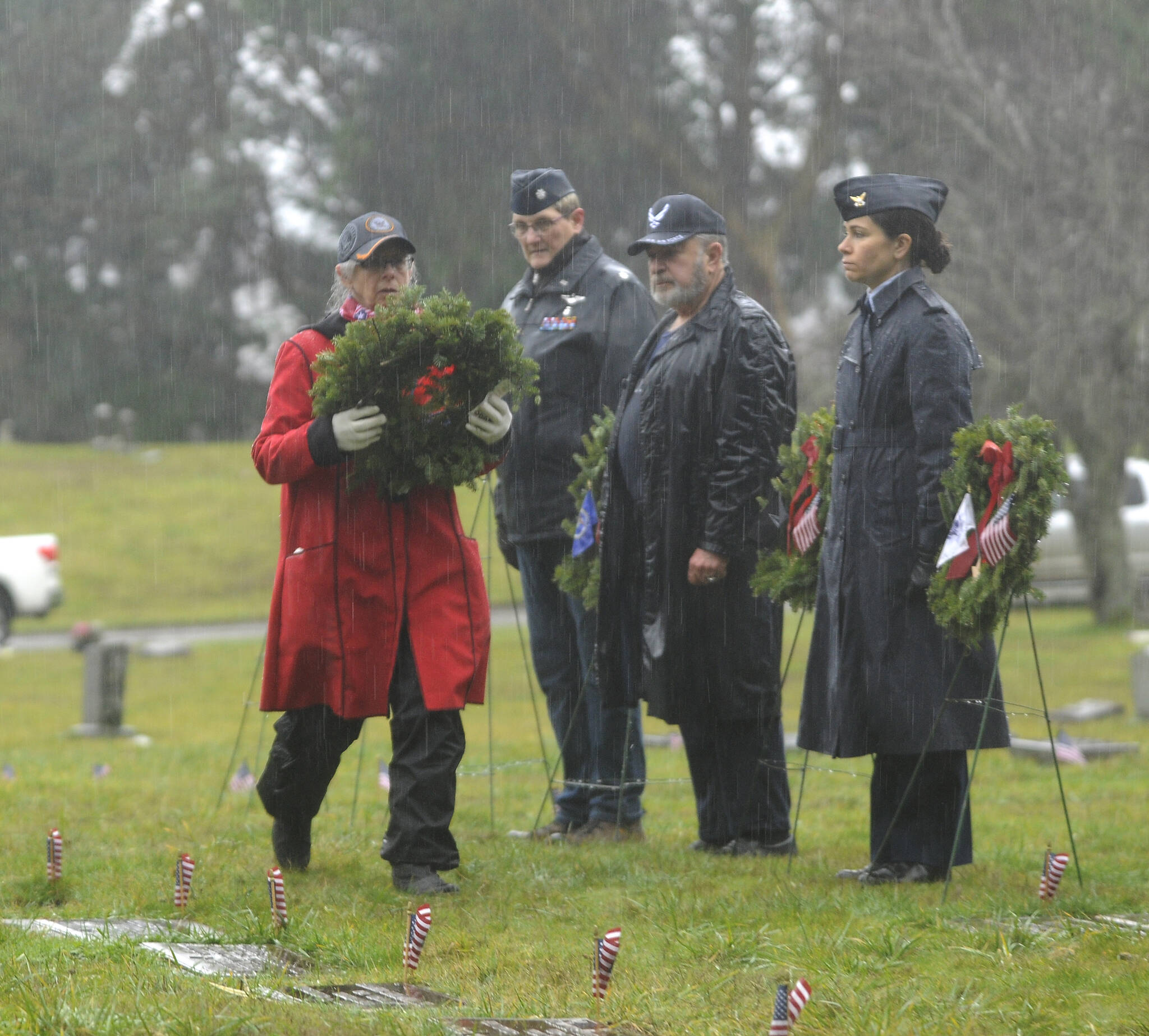 Commander Lorri Gilchrist (ret.) prepares to lay a wreath to honor those veterans who served in the U.S. Navy at Saturday’s Wreaths Across America event. Sequim Gazette photos by Michael Dashiell