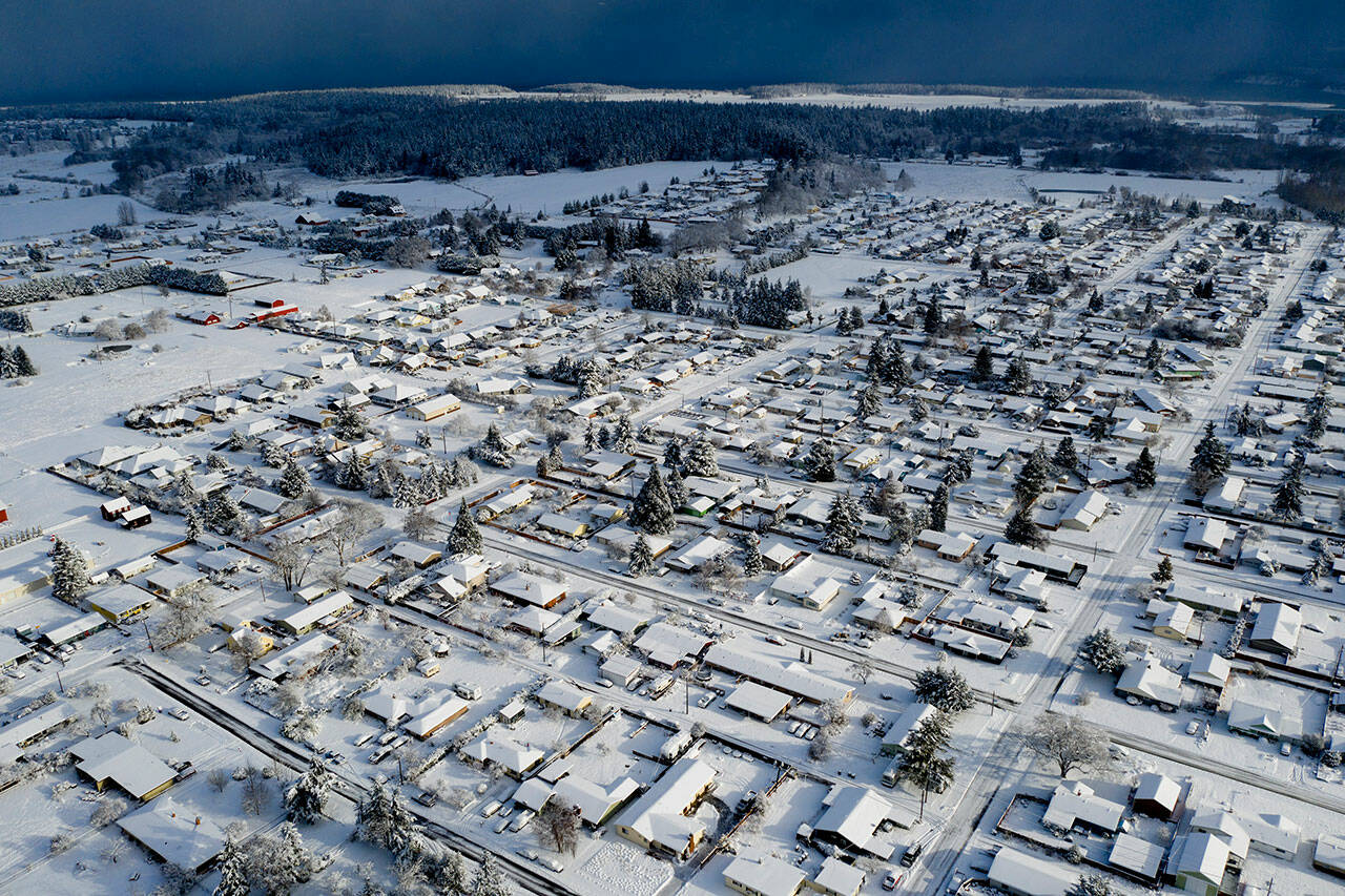 Photographer/videographer John Gussman captured this aerial view of the Sequim-Dungeness Valley following this past weekend’s snowfall.