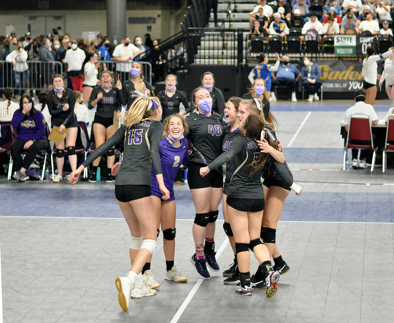 Sequim teammates celebrate at point at the state 2A volleyball tournament in Yakima on Nov. 19. Pictured, from left, is Kendall Hastings, Jordan Hegtvedt, Malory Morey, Angel Wagner, Jolene Vaara and Allie Gale. Photo by Wendy Morey