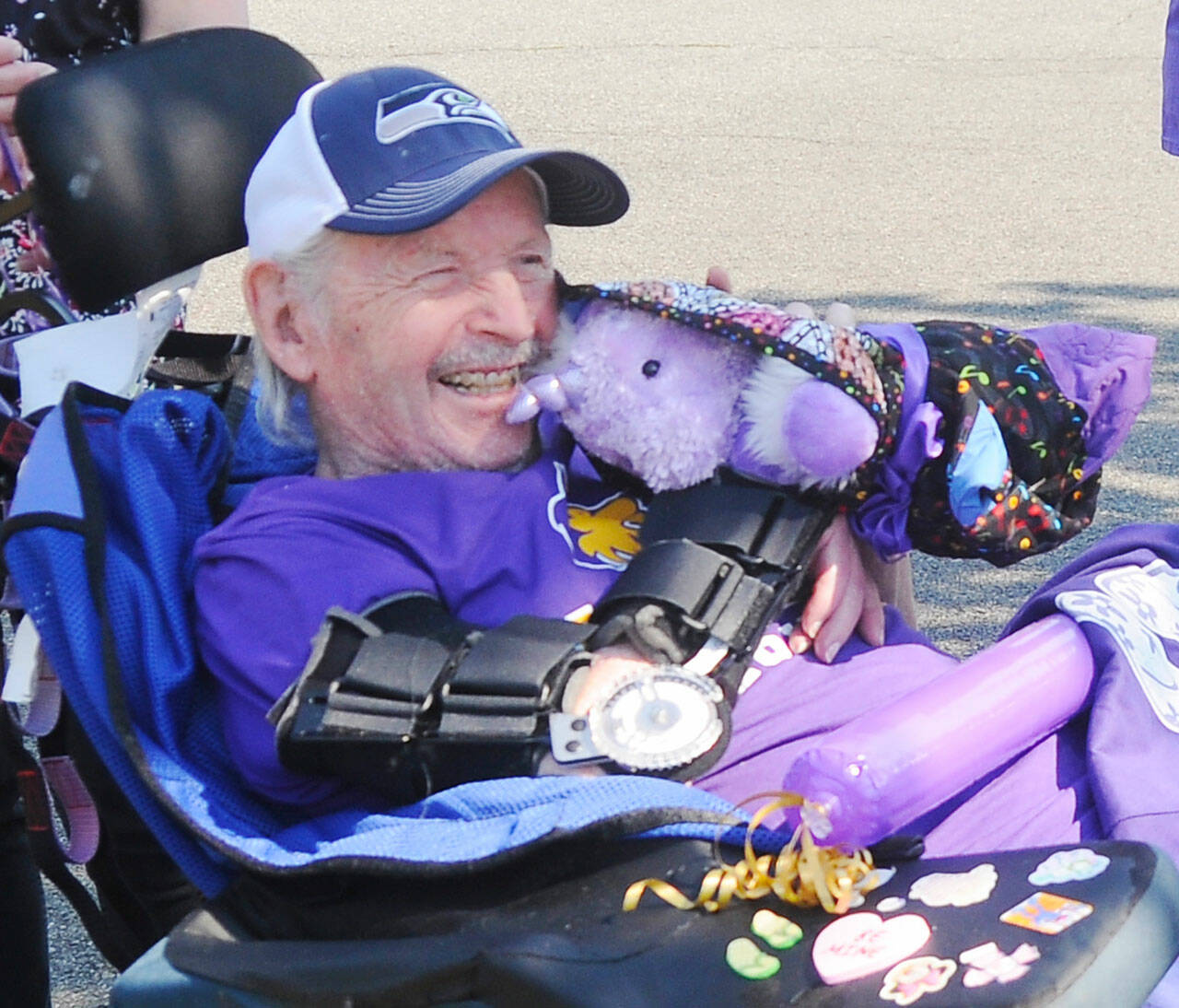 Myron Teterud, a longtime Sequim High sports fan, enjoys some gifts from Sequim Alumni Association members and friends in September 2020. He died in April 2021. Sequim Gazette photo by Michael Dashiell