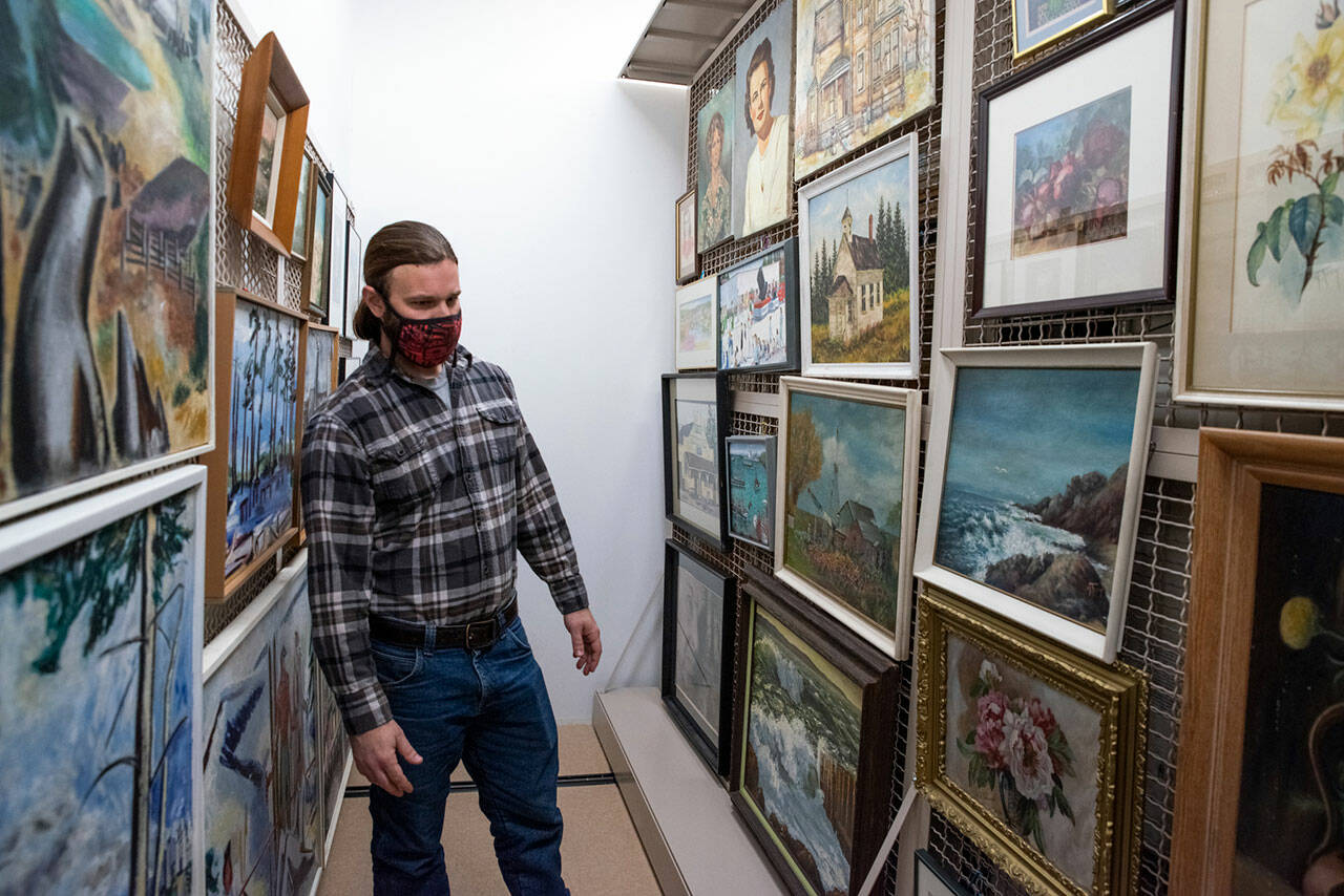 At the North Olympic History Center in Port Angeles, many decades of paintings by local artists are stored in a climate-controlled building which was the former Lincoln School’s gymnasium. Sequim Gazette photo by Emily Matthiessen
