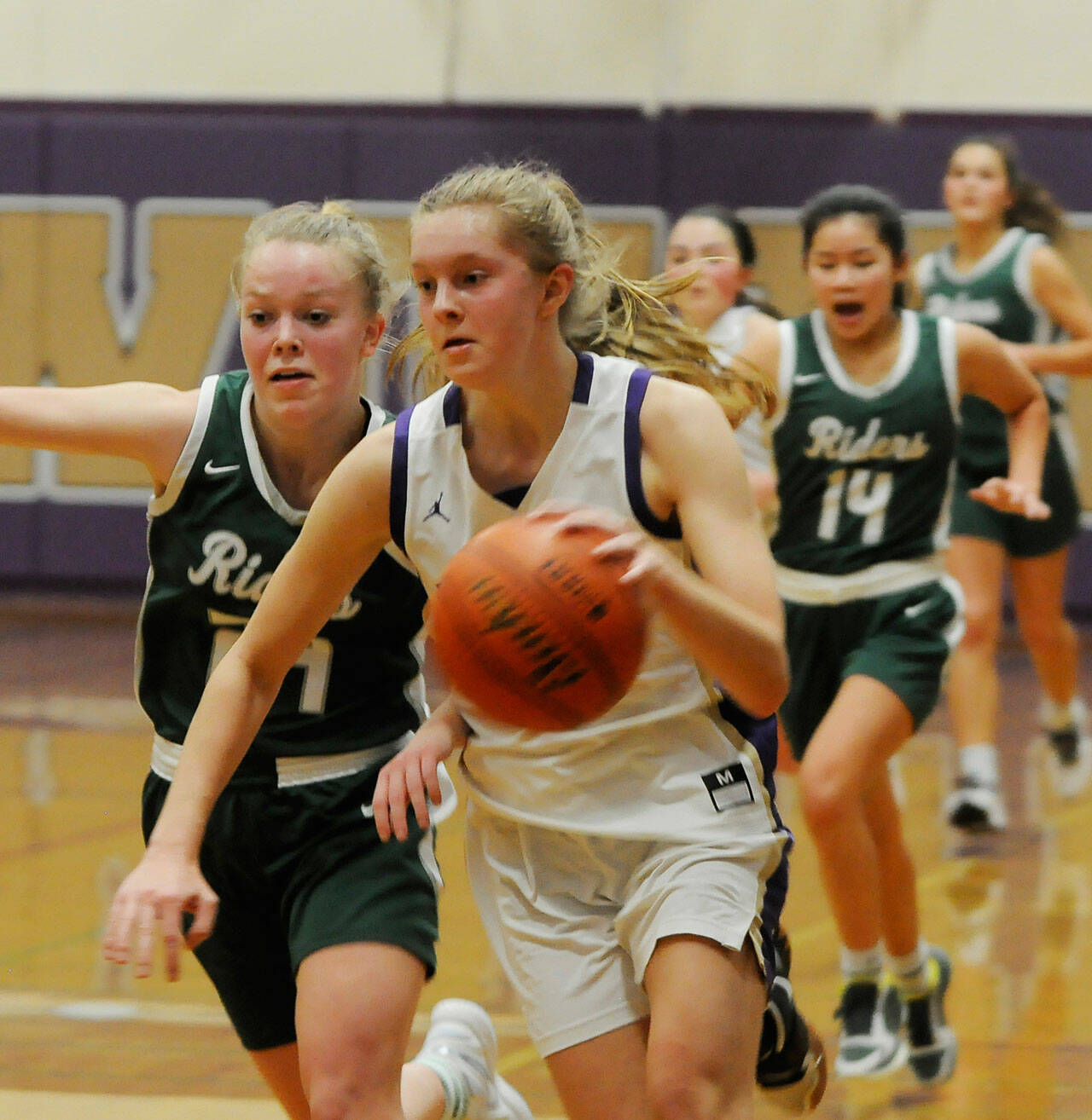 Sequim’s Jolene Vaara, right, helps lead the Wolves to a 60-55 win over rival Port Angeles on Jan. 11. Vaara scored a game-high 31 points, 21 in the second half.