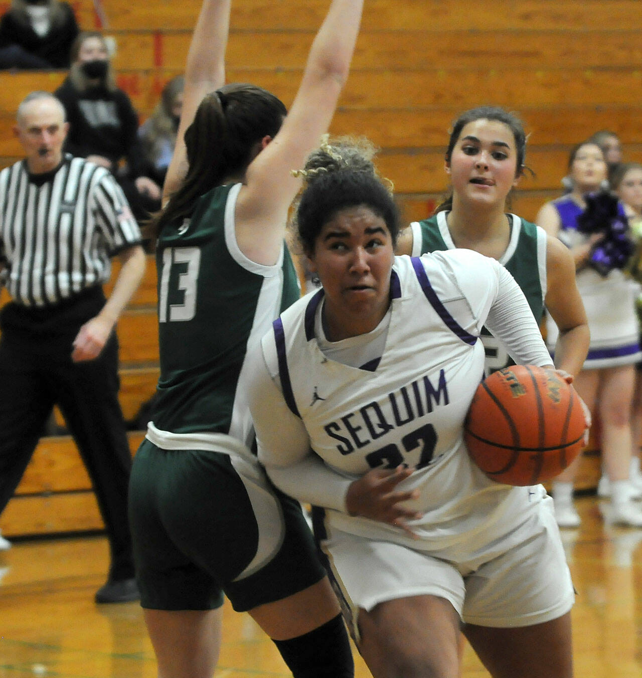 Sequim’s Jelissa Julmist, right, drives past Port Angeles’ Bailee Larson in the second half of Sequim’s 60-55 win over the Roughriders on Jan. 11. Sequim Gazette photo by Michael Dashiell