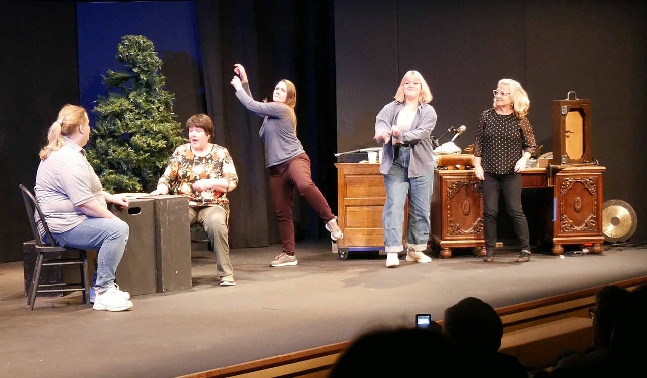 Photo courtesy of Olympic Theatre Arts
The Imagined Reality Improv troupe spontaneously performs on OTA’s partially built Christmas Carol set on the main stage to accommodate an overflow crowd in November. Pictured, from left, are Andrejs Zommers, Nancy Peterson, Michelle Allen, Rose Weaver and Marybeth Redmond. Not pictured is Tyler Weaver.