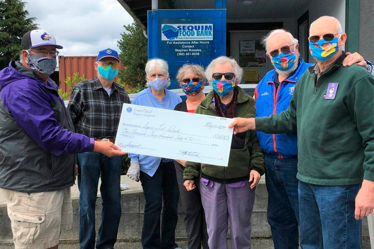 Submitted photo
In May 2020, members of the Kiwanis Club of Sequim-Dungeness donated to the Sequim Food Bank at the beginning of the COVID-19 pandemic. Pictured, from left, are Stephen Rosales with the Food Bank, Wayne and Mary Boden, Philomena Lund, Janice Teeter, Richard Fleck and Ted Lund.