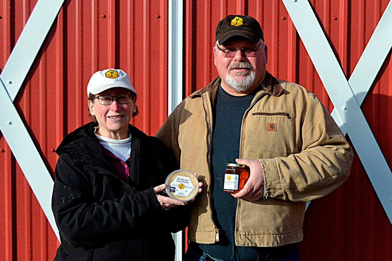 Meg and Buddy DePew’s Sequim Bee Farm, seen here in 2020, won a medal again for their Dungeness Fields Honey from the national Good Food Awards competition. They plan to debut it at the Sequim Sunshine Festival in March. Sequim Gazette file photo by Matthew Nash