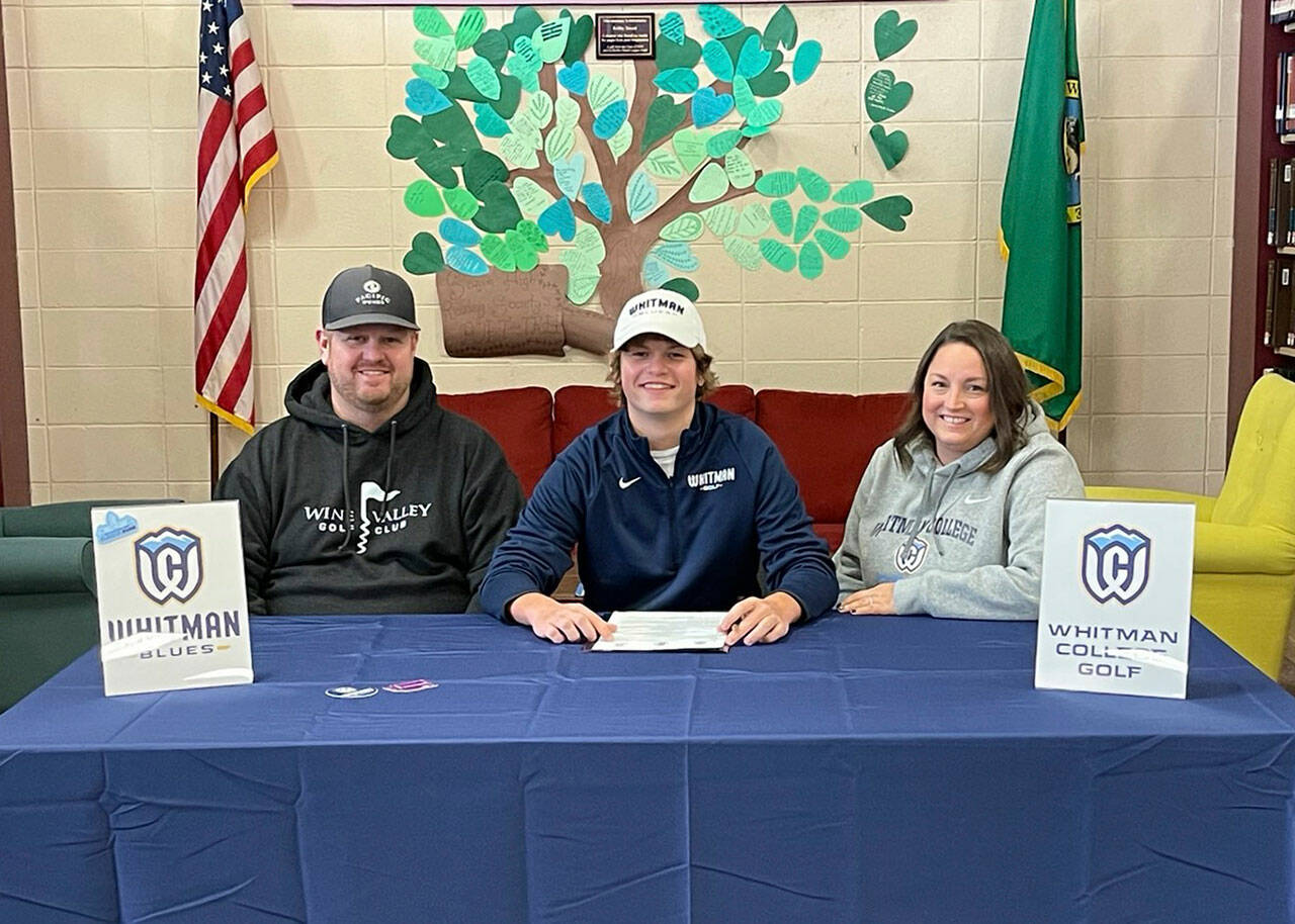 Submitted photo
Sequim High senior Ben Sweet, center, signs a letter of intent in January to play for the men’s golf team at Whitman College this fall. Pictured with Sweet are his parents Tyler and Stephanie Sweet.