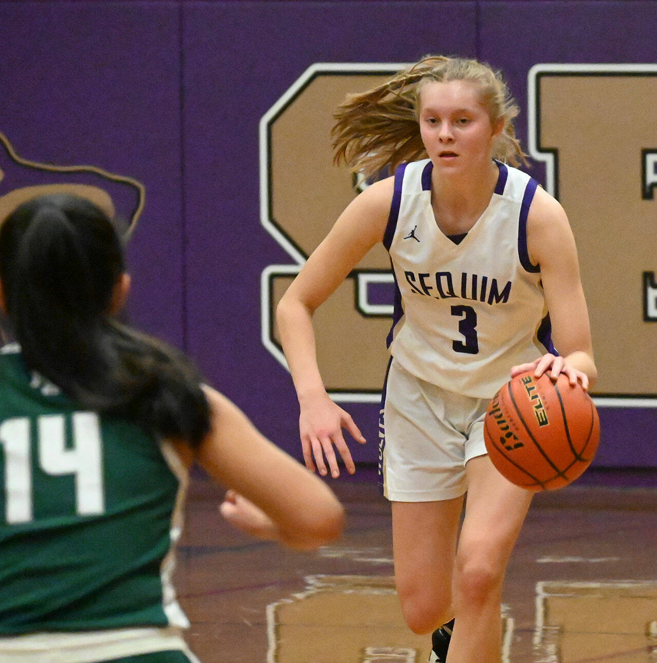 Sequim's Jolene Vaara, pictured here bringing the ball upcourt in a win over Bremerton on Jan. 22, had 11 points, seven rebounds, four steals and three blocked shots in the Wolves' 67-20 rout of North Mason on Jan. 25.  Sequim Gazette file photo by Michael Dashiell