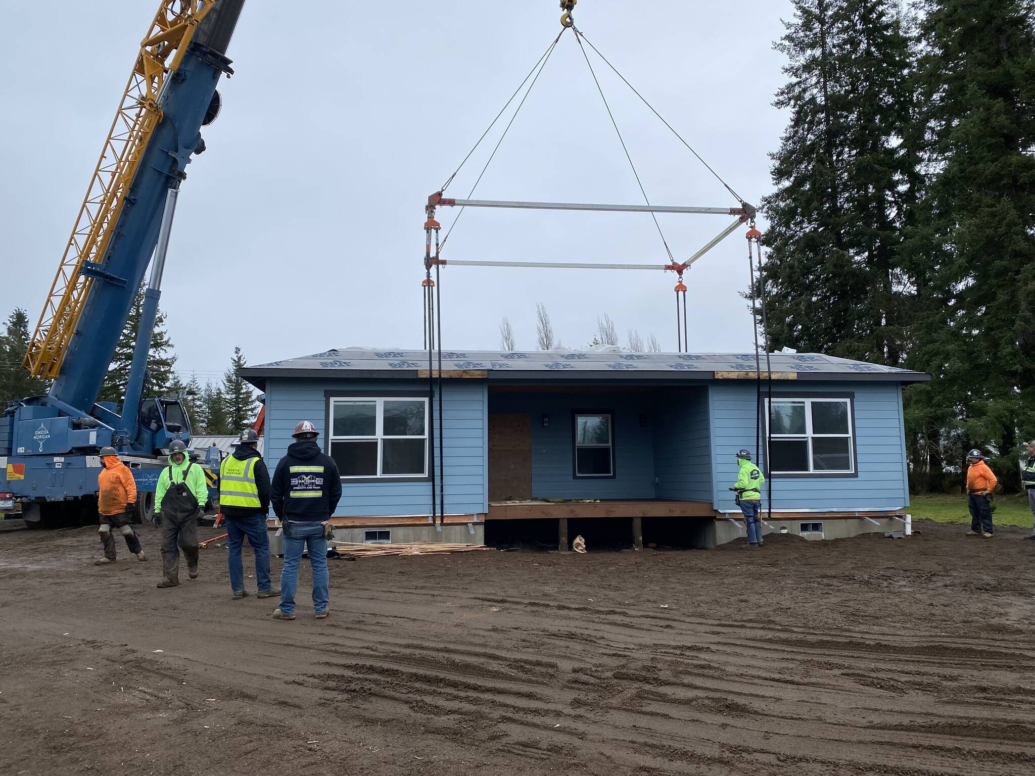 The final section of the Hobuck House, a seven-bedroom group home for permanently disabled homeless veterans, is set in place in Forks last week. Photo by Cheri Tinker, NORVHN Director