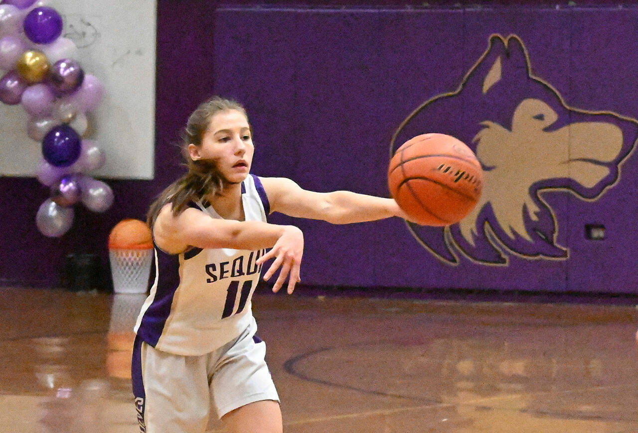Sequim guard Taryn Johnson looks for an open teammate in the fourth quarter of the Wolves 45-41 win over Kingston on Feb. 8. Sequim Gazette photo by Michael Dashiell