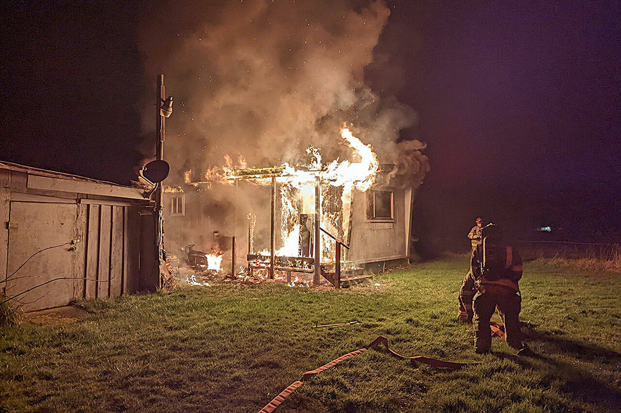 Clallam County Fire District 3 firefighters pulled a man from his home near Woodcock Road on Sunday night within 90 seconds of arriving on scene. Photo courtesy Clallam County Fire District 3