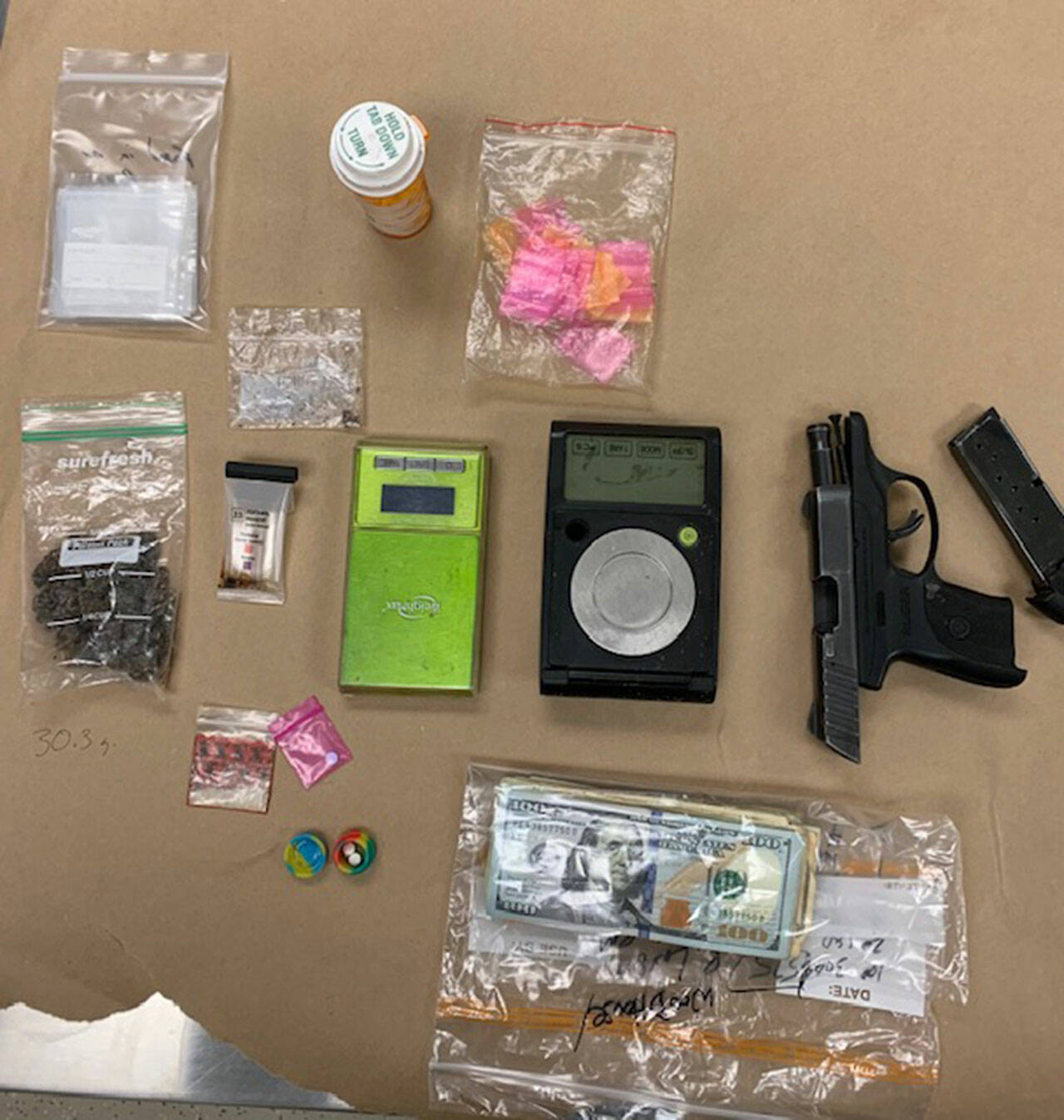 Evidence recovered from arrests at a Sequim apartment on March 28 include 30.3 grams of suspected fentanyl, 22.5 grams of suspected heroin, smaller quantities of various controlled substances, digital scales, packaging materials and a 9 mm pistol.