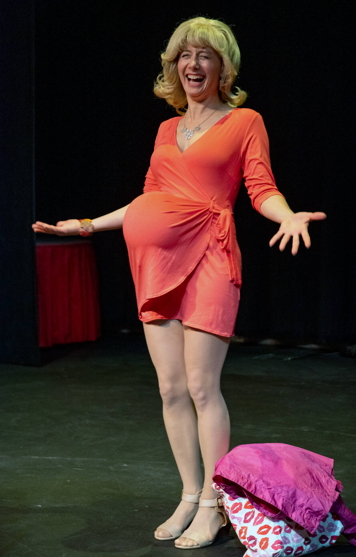 Mindy Gelder shares a laugh as she tests a balloon in skirt for a flashback scene at the bingo hall in a rehearsal for Bingo A Winning Musical at Olympic Theatre Arts in Sequim. Sequim Gazette photo by Emily Matthiessen