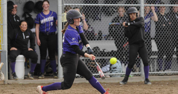 Sequim Gazette photo by Michael Dashiell
Sequim’s Christy Grubb crushes a pitch for a double in the Wolves’ 12-0 win over Forks on March 18.