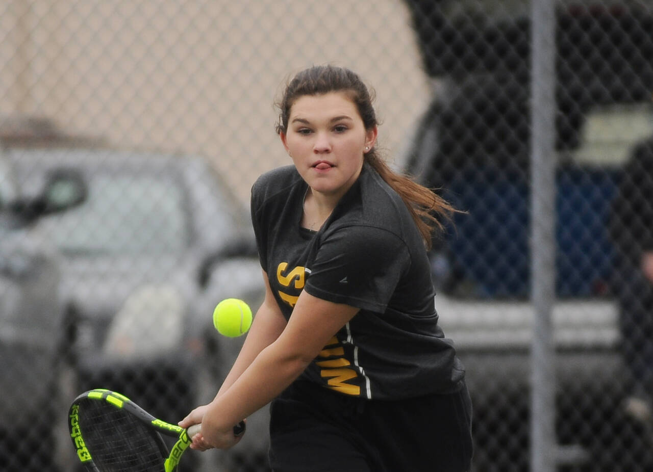 Sequim’s Allie Gale looks to return a shot as she takes on Kingston’s Alissa Doyle on May 3. Gale won in straight sets.